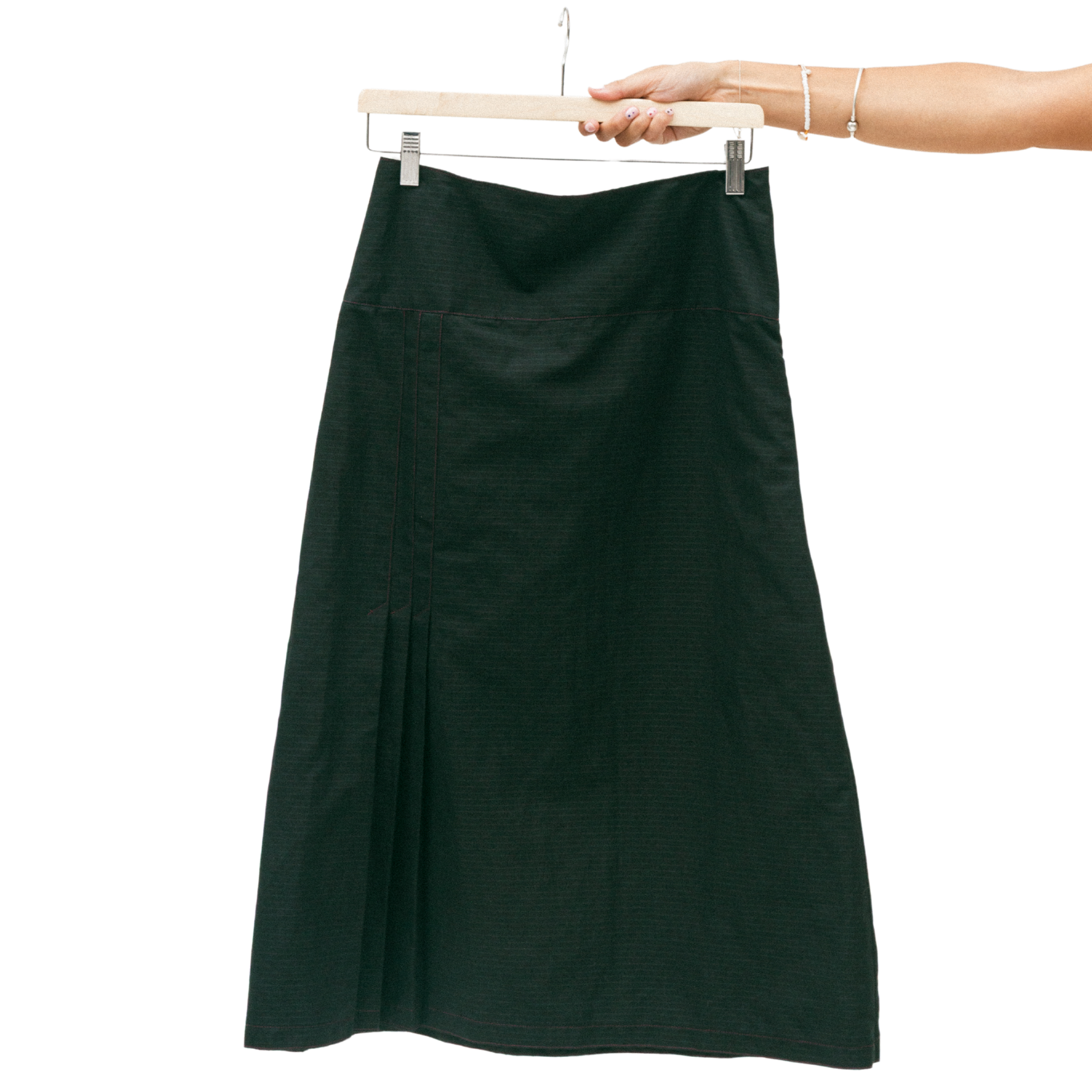 Black skirt on a hanger against a white background